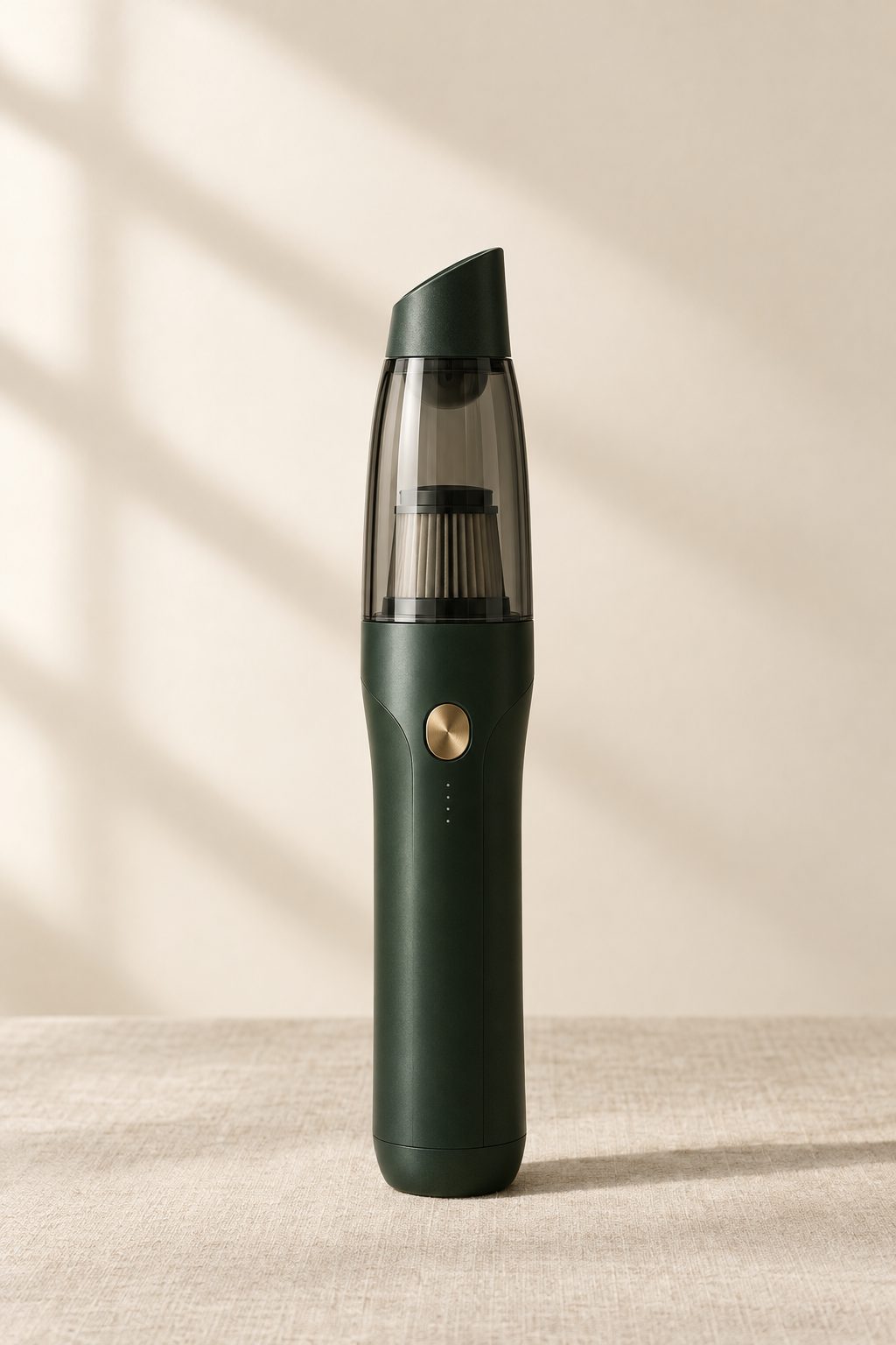 AERIKAI A-015K, a matte forest green handheld car vacuum with a brushed brass power button.